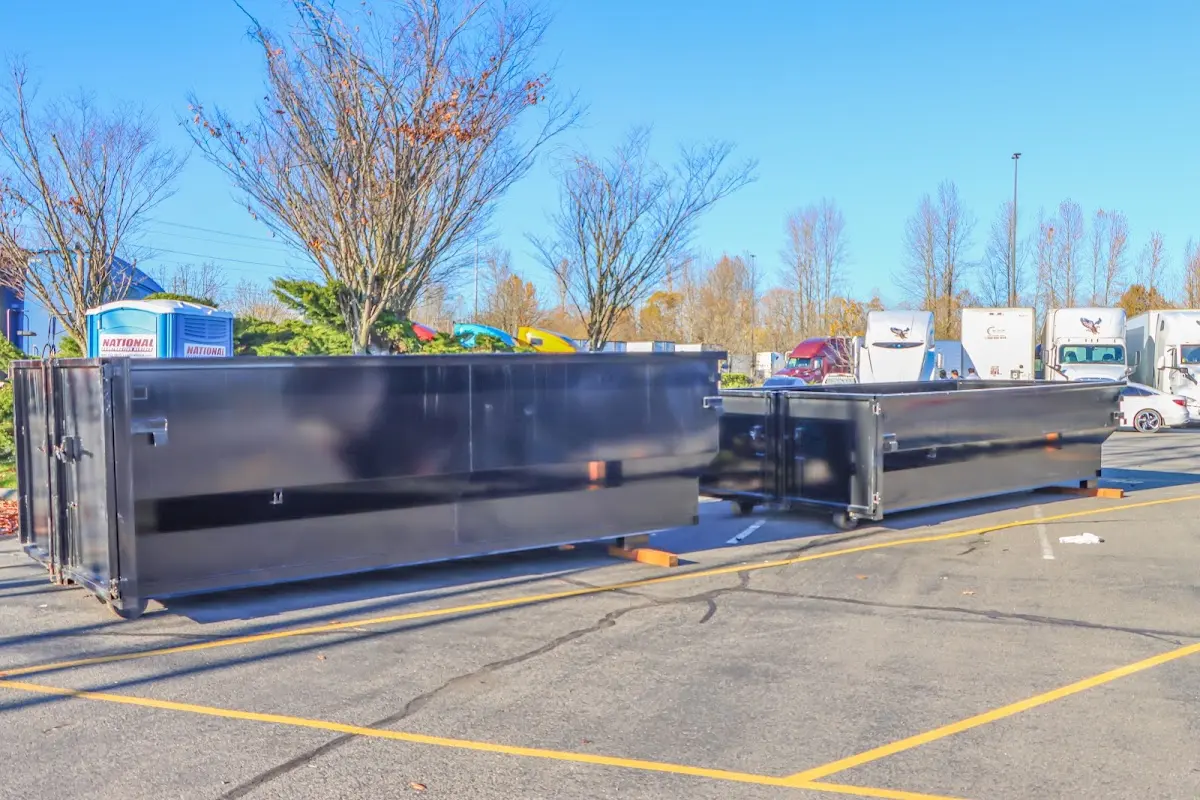 Professional dumpster rental service with roll-off container on residential driveway in Rohnert Park